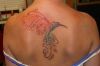 hummingbird tats on back of girl